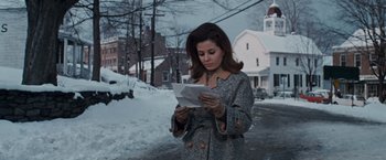 Movie still from “Valley of the Dolls” (1967), directed by Mark Robson – A woman standing on the side of a road looking at a piece of paper; Medium shot, Low angle