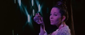 Movie still from “Valley of the Dolls” (1967), directed by Mark Robson – A woman is holding a ball in her hand; Close Up shot, Low angle
