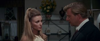 Movie still from “Valley of the Dolls” (1967), directed by Mark Robson – A man and a woman are looking at each other; Close Up shot, Over the shoulder angle