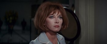 Movie still from “Valley of the Dolls” (1967), directed by Mark Robson – A person with short brown hair; Close Up shot, Low angle