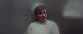 Movie still from “Valley of the Dolls” (1967), directed by Mark Robson – A woman wearing a white nurse's uniform; Close Up shot, Low angle