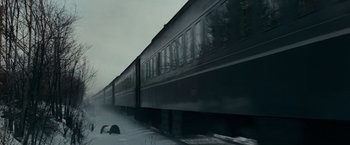 Movie still from “Valley of the Dolls” (1967), directed by Mark Robson – A train traveling down train tracks in the snow; Extreme Wide shot, Low angle