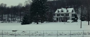 Movie still from “Valley of the Dolls” (1967), directed by Mark Robson – A large white house sitting on top of a snow covered field; Extreme Wide shot, Low angle