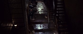 Movie still from “Valley of the Dolls” (1967), directed by Mark Robson – A view down a set of stairs in the dark; Extreme Wide shot, Overhead angle