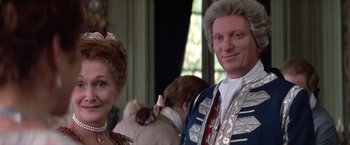 Movie still from “Valmont” (1989), directed by Milos Forman – A man and a woman dressed up for a party; Close Up shot, Over the shoulder angle