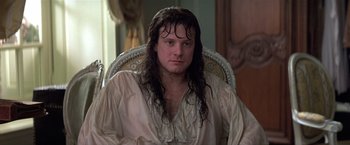 Movie still from “Valmont” (1989), directed by Milos Forman – A man sitting in a chair with long black hair; Close Up shot, Over the shoulder angle
