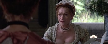 Movie still from “Valmont” (1989), directed by Milos Forman – An older woman wearing a white dress and a white hat; Close Up shot, Over the shoulder angle