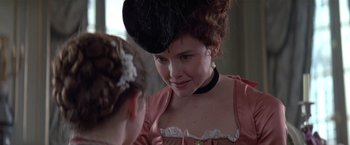 Movie still from “Valmont” (1989), directed by Milos Forman – A woman in a pink dress and a black hat; Close Up shot, Over the shoulder angle