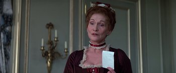 Movie still from “Valmont” (1989), directed by Milos Forman – An older woman holding a piece of paper in her hand; Close Up shot, Over the shoulder angle