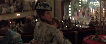 Movie still from “Valmont” (1989), directed by Milos Forman – A woman and a little girl dressed in period clothing; Medium shot, Over the shoulder angle