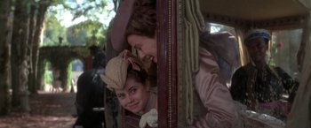 Movie still from “Valmont” (1989), directed by Milos Forman – Two women in old - fashioned clothing looking at each other; Medium shot, Over the shoulder angle