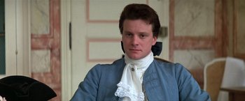 Movie still from “Valmont” (1989), directed by Milos Forman – A man in a blue coat and a white shirt; Close Up shot, High angle