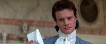 Movie still from “Valmont” (1989), directed by Milos Forman – A person holding a piece of paper; Close Up shot, Over the shoulder angle