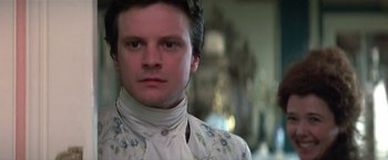 Movie still from “Valmont” (1989), directed by Milos Forman – A person wearing a suit and tie; Close Up shot, Low angle