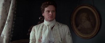 Movie still from “Valmont” (1989), directed by Milos Forman – A man in a suit with a tie around his neck; Close Up shot, Over the shoulder angle