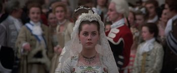 Movie still from “Valmont” (1989), directed by Milos Forman – A woman in a white dress with a veil on her head; Close Up shot, High angle