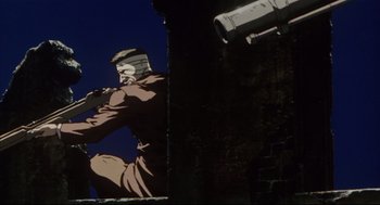 Movie still from “Vampire Hunter D: Bloodlust” (2000), directed by Yoshiaki Kawajiri – An image of a man holding a gun on a wall; Wide shot, Low angle