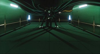 Movie still from “Vampire Hunter D: Bloodlust” (2000), directed by Yoshiaki Kawajiri – A man in a black suit standing in front of a green wall; Wide shot, Low angle