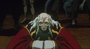 Movie still from “Vampire Hunter D: Bloodlust” (2000), directed by Yoshiaki Kawajiri – An animated picture of an old man with long white hair; Close Up shot, Low angle