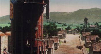 Movie still from “Vampire Hunter D: Bloodlust” (2000), directed by Yoshiaki Kawajiri – An oil painting of an old train station in the middle of the day; Extreme Wide shot, High angle