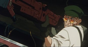 Movie still from “Vampire Hunter D: Bloodlust” (2000), directed by Yoshiaki Kawajiri – An animated man holding a gun in a dark room; Close Up shot, Low angle