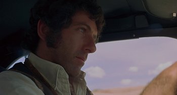 Movie still from “Vanishing Point” (1971), directed by Richard C. Sarafian – A person in a car; Close Up shot, Low angle