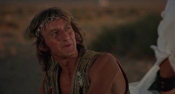 Movie still from “Vanishing Point” (1971), directed by Richard C. Sarafian – A person with long hair wearing a crown; Close Up shot, Low angle