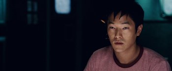 Movie still from “Vantage Point” (2008), directed by Pete Travis – A young man is looking into the camera; Close Up shot, High angle