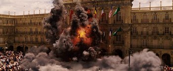 Movie still from “Vantage Point” (2008), directed by Pete Travis – An explosion in the middle of a building; Extreme Wide shot, Low angle