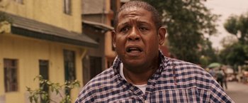 Movie still from “Vantage Point” (2008), directed by Pete Travis – An older black man with an angry look on his face; Close Up shot, Low angle