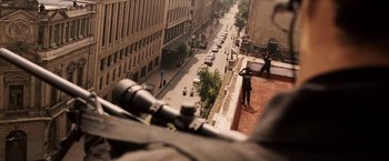 Movie still from “Vantage Point” (2008), directed by Pete Travis – A view of a street from a building looking out over a city; Wide shot, High angle