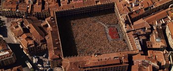 Movie still from “Vantage Point” (2008), directed by Pete Travis – An aerial view of a crowd of people in a square; Extreme Wide shot, High angle
