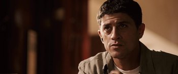 Movie still from “Vantage Point” (2008), directed by Pete Travis – A person wearing a jacket; Close Up shot, Over the shoulder angle