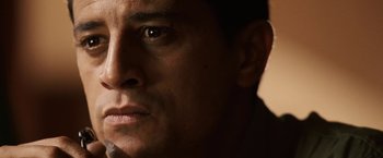 Movie still from “Vantage Point” (2008), directed by Pete Travis – A man's face in the dark; Close Up shot, Low angle