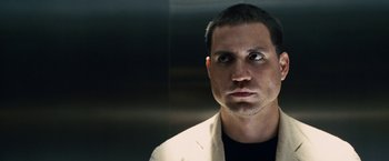 Movie still from “Vantage Point” (2008), directed by Pete Travis – A person wearing a white jacket; Close Up shot, Low angle