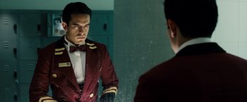 Movie still from “Vantage Point” (2008), directed by Pete Travis – A man looking at himself in the mirror; Medium shot, Over the shoulder angle