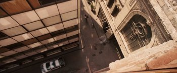 Movie still from “Vantage Point” (2008), directed by Pete Travis – An aerial view looking down at a city street; Extreme Wide shot, Overhead angle