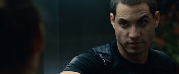 Movie still from “Vantage Point” (2008), directed by Pete Travis – A person wearing a black shirt; Close Up shot, Over the shoulder angle