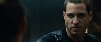 Movie still from “Vantage Point” (2008), directed by Pete Travis – A person wearing a black shirt; Close Up shot, Over the shoulder angle