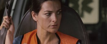 Movie still from “Vantage Point” (2008), directed by Pete Travis – A person wearing an orange shirt; Close Up shot, Over the shoulder angle