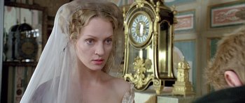 Movie still from “Vatel” (2000), directed by Roland Joffé – A woman with a veil on her head standing in front of a clock; Close Up shot, Over the shoulder angle