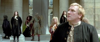 Movie still from “Vatel” (2000), directed by Roland Joffé – A group of people dressed in period clothing; Medium shot, Over the shoulder angle