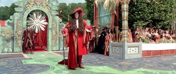 Movie still from “Vatel” (2000), directed by Roland Joffé – A man dressed as a pirate standing in front of a crowd; Wide shot, Over the shoulder angle