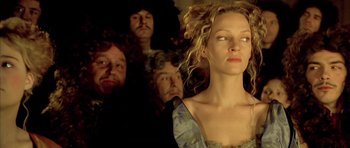 Movie still from “Vatel” (2000), directed by Roland Joffé – A group of people standing around a woman; Close Up shot, Low angle