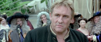 Movie still from “Vatel” (2000), directed by Roland Joffé – A person wearing a jacket; Close Up shot, Over the shoulder angle