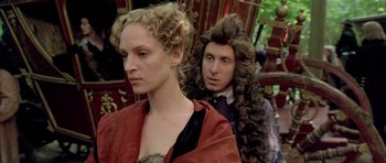 Movie still from “Vatel” (2000), directed by Roland Joffé – A man and a woman in medieval garb standing next to each other; Close Up shot, Over the shoulder angle