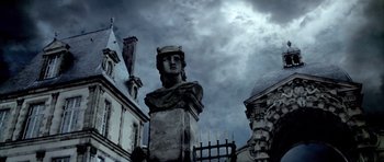 Movie still from “Vatel” (2000), directed by Roland Joffé – A statue of a woman with a crown on her head; Extreme Wide shot, Low angle