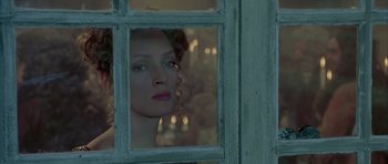 Movie still from “Vatel” (2000), directed by Roland Joffé – A person looking through a window; Close Up shot, Over the shoulder angle