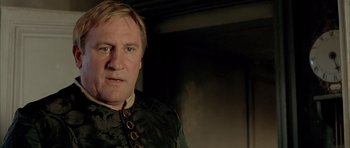 Movie still from “Vatel” (2000), directed by Roland Joffé – A person wearing a military outfit; Close Up shot, Low angle