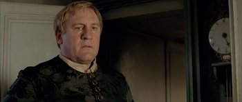 Movie still from “Vatel” (2000), directed by Roland Joffé – A person wearing a suit; Close Up shot, Low angle